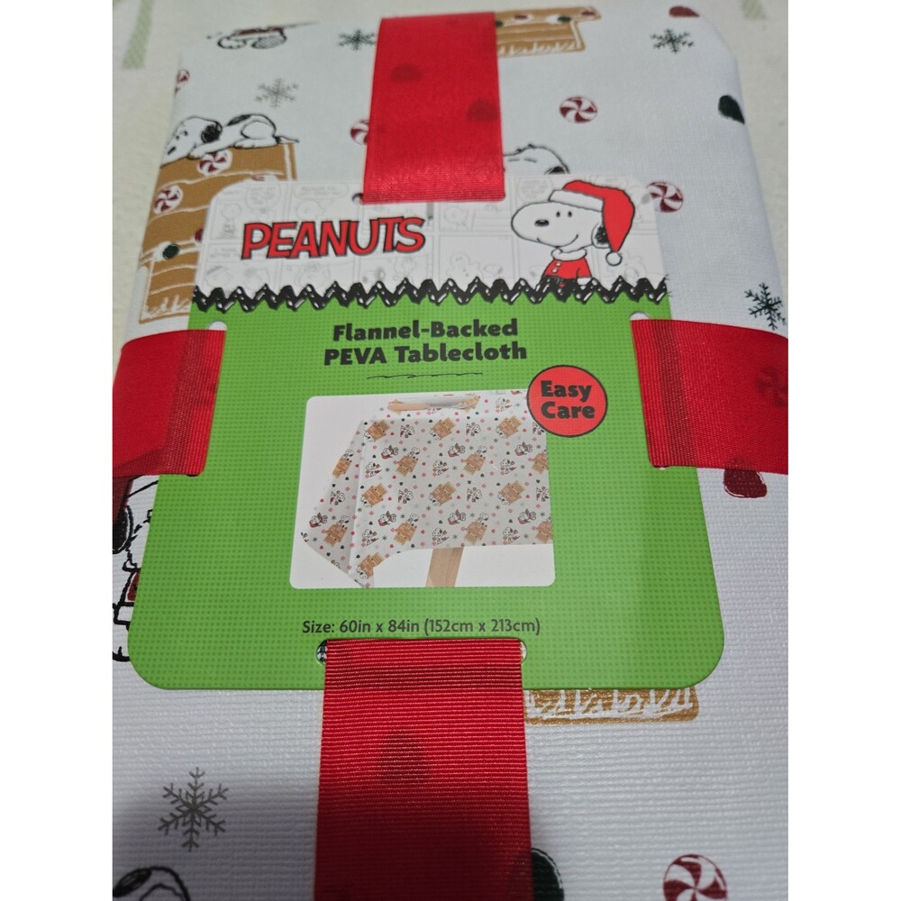PEANUTS Snoopy Gingerbread House Flannel-Backed PEVA Tablecloth 60" x 84" - Picture 2 of 4
